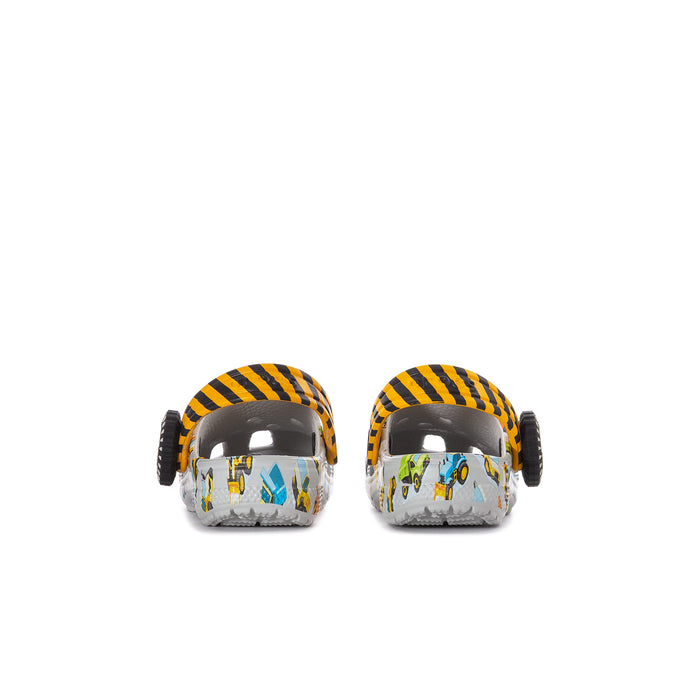 Back view of toddler clogs with white car print and orange/yellow striped heel straps