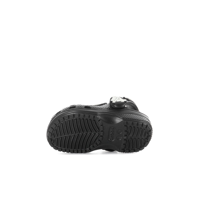 Toddler black clog sole with textured tread, skeleton charm visible at heel.