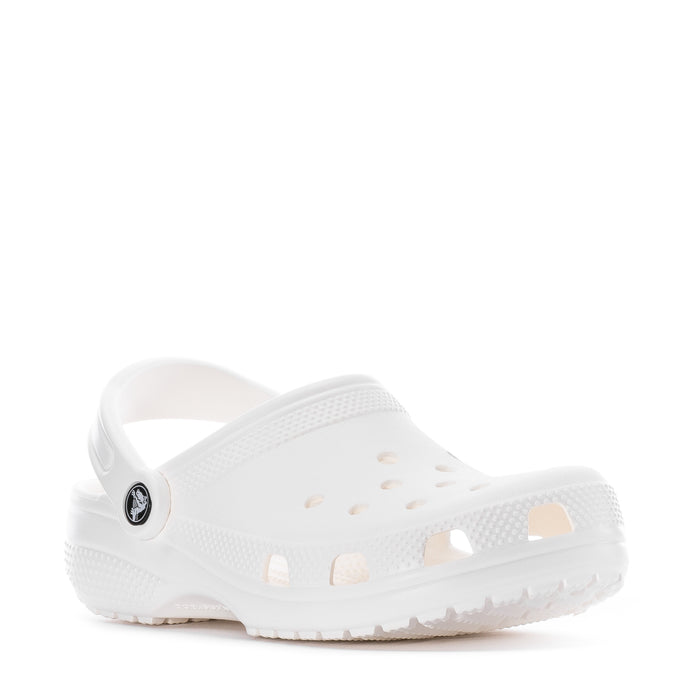 Youth white clog angled view; vented holes and round logo on strap.