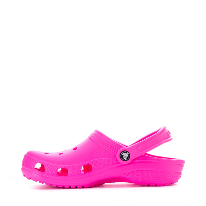 Youth Crocs classic clog in bright pink, side profile with vent holes