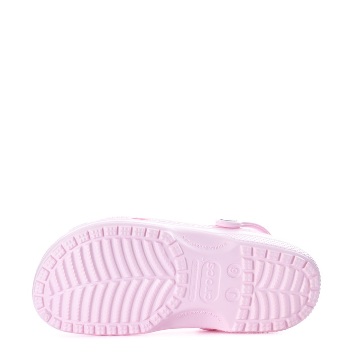 Light pink youth clog outsole with textured tread pattern