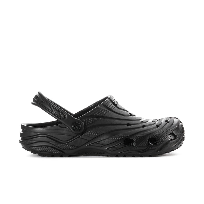Black men's slip-on clog with perforated upper and adjustable heel strap.