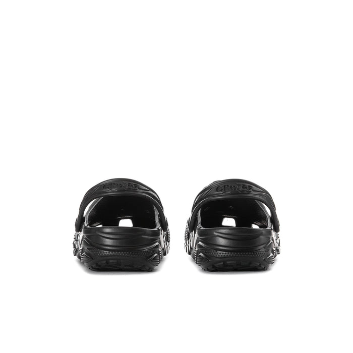 Black men's clog pair from heel: rounded back with cushioned straps and ventilation.