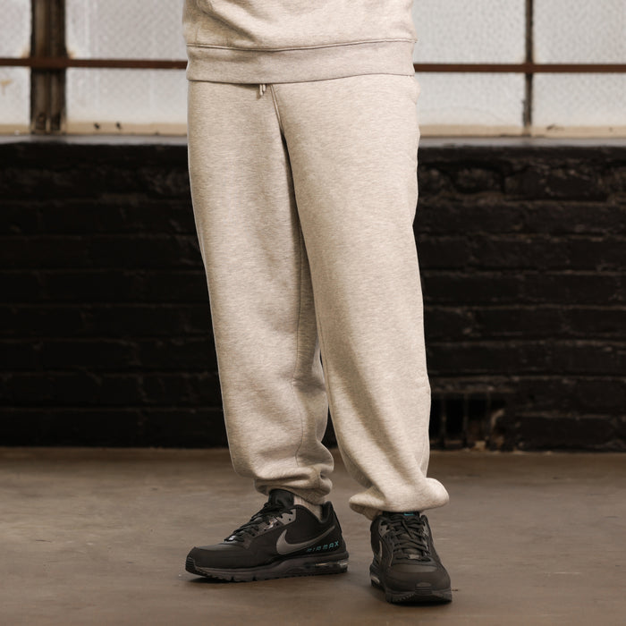 Heather grey fleece sweatpants with side pockets and cuffed hems