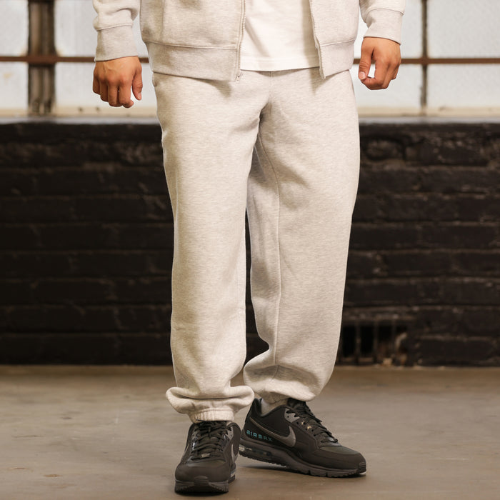Heather grey fleece sweatpants with front pockets and cuffed ankle hem