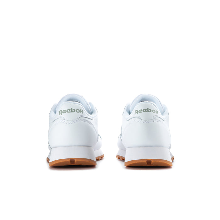 Men's white Reebok leather sneakers from heel, with gum-brown outsole trim