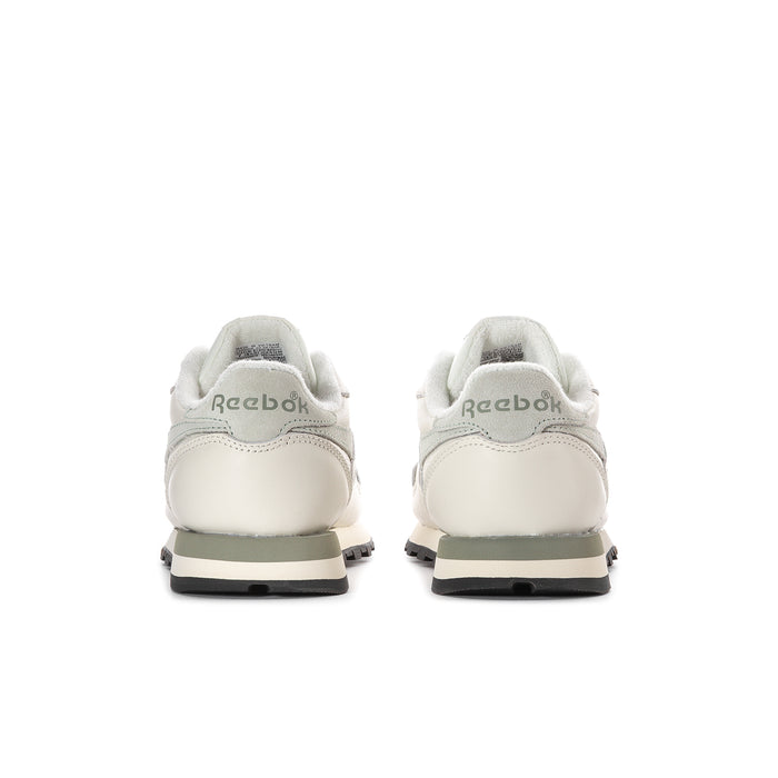 Women’s off-white leather sneakers, rear view with cushioned heel and black rubber sole