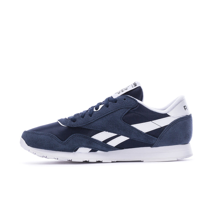 Men's navy low-top sneakers with white stripe panels and lace-up, side angle view.