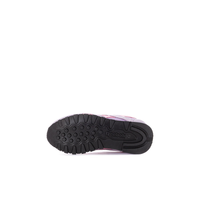 Toddler purple Reebok sneaker outsole view with tread for traction