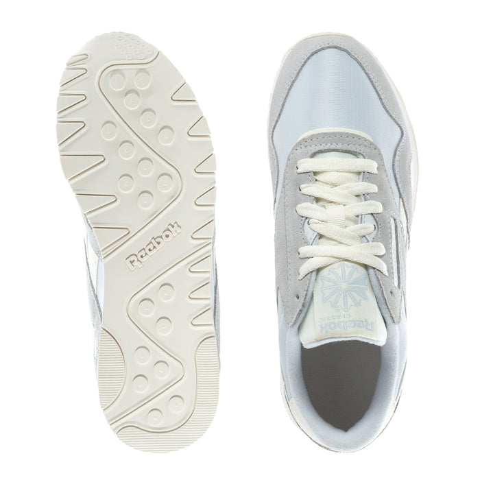 Shoe outsole and side view of women's sneakers with grippy tread and blue lining