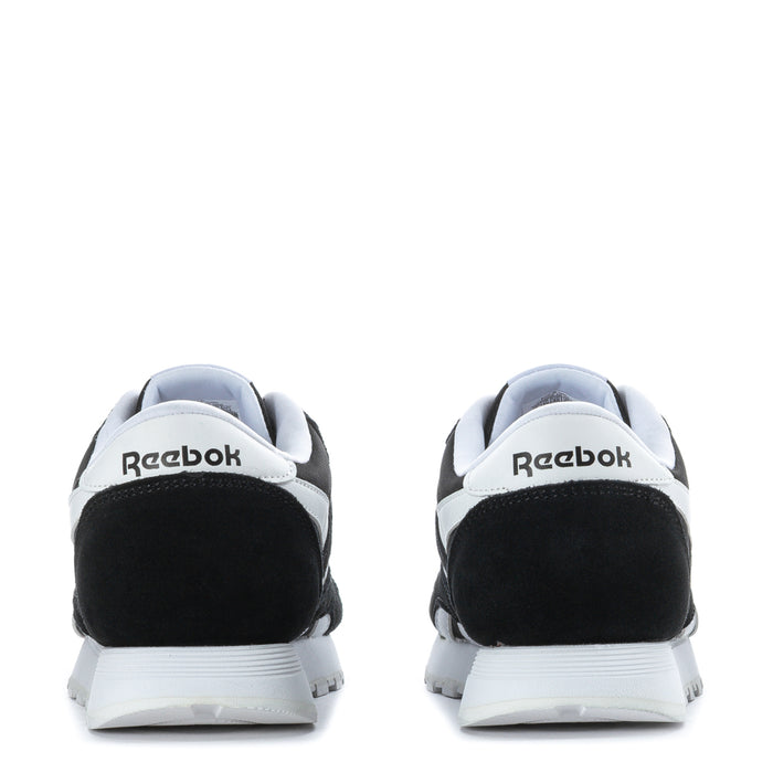 Reebok youth sneakers heel view in black with white accents and logo