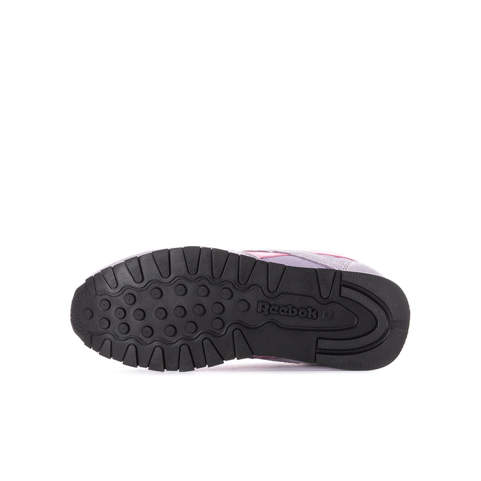 Youth lilac sneaker outsole view with textured tread and pink heel accent