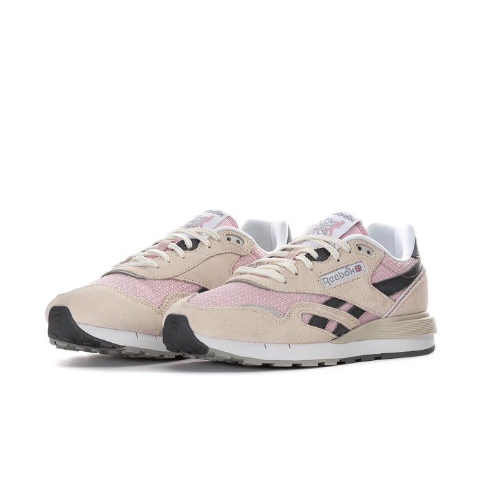Women's Reebok low-top sneakers in beige, pink, and black with lace-up front