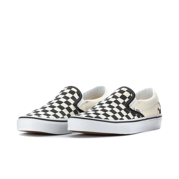 Pair of men's Vans slip-on sneakers, black and white checkerboard uppers, white sole