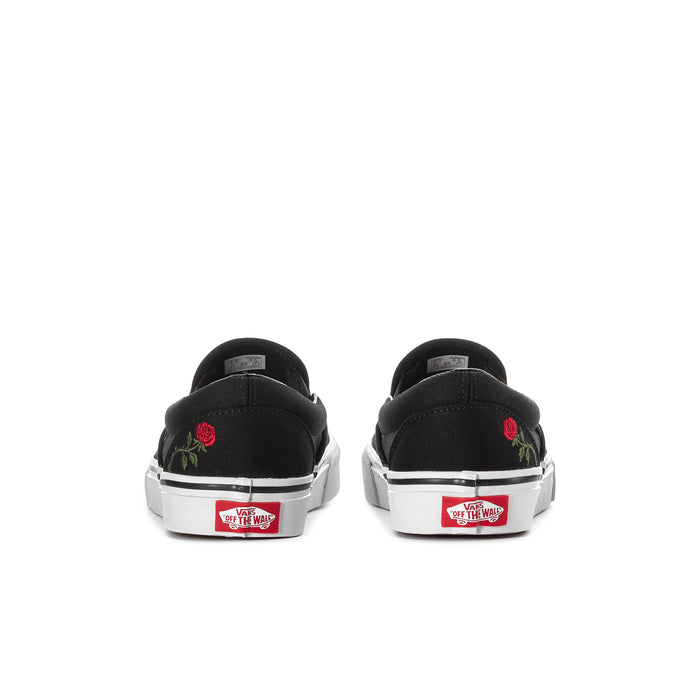 Black VANS slip-on sneakers, heel view, with red rose embroidery and label patch