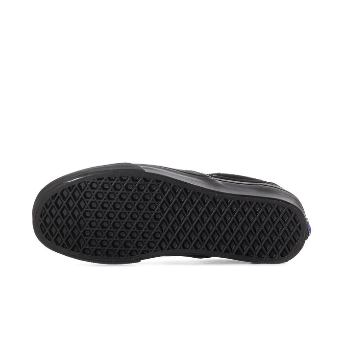 Women's black slip-on sneaker outsole view, textured tread pattern