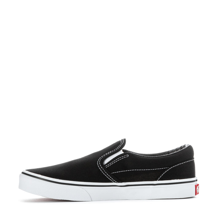 Youth black slip-on sneaker with white sidewall stripe and low-profile sole
