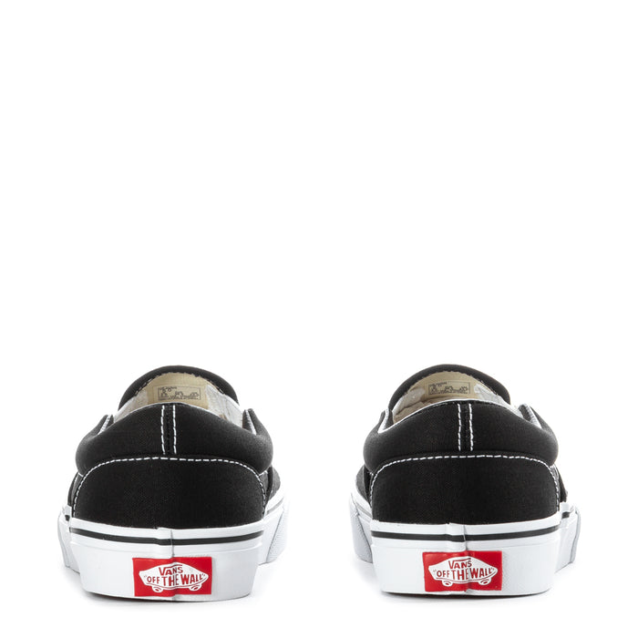 Youth Vans black slip-on sneakers, rear view with white heel trim and tags