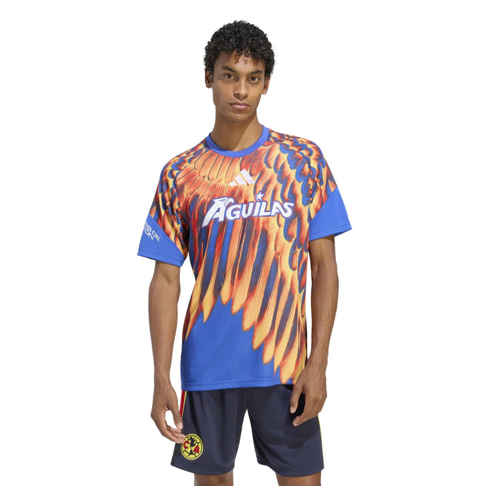 Men's pregame jersey front view, bright blue with orange flame-feather pattern and Aguilas logo