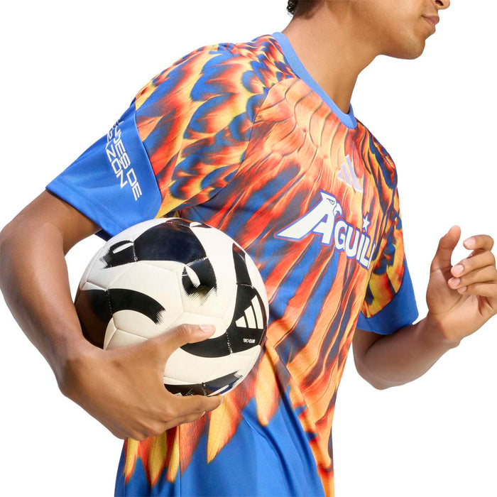 Men's pregame jersey close-up: blue collar and Aguilas chest logo with flame-feather print