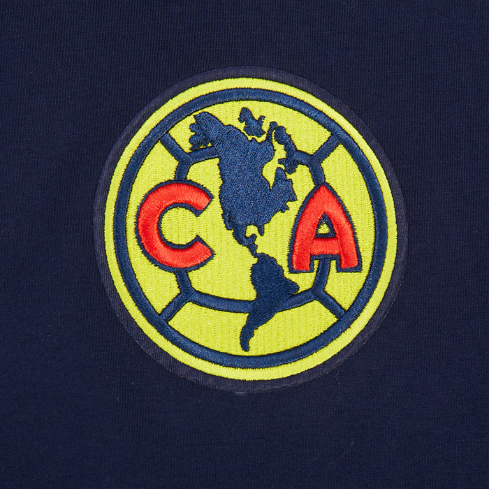 Navy fabric with embroidered Club America circular crest in green, red, and yellow