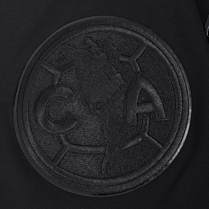 Triple black crew-neck T-shirt chest close-up of circular embossed logo