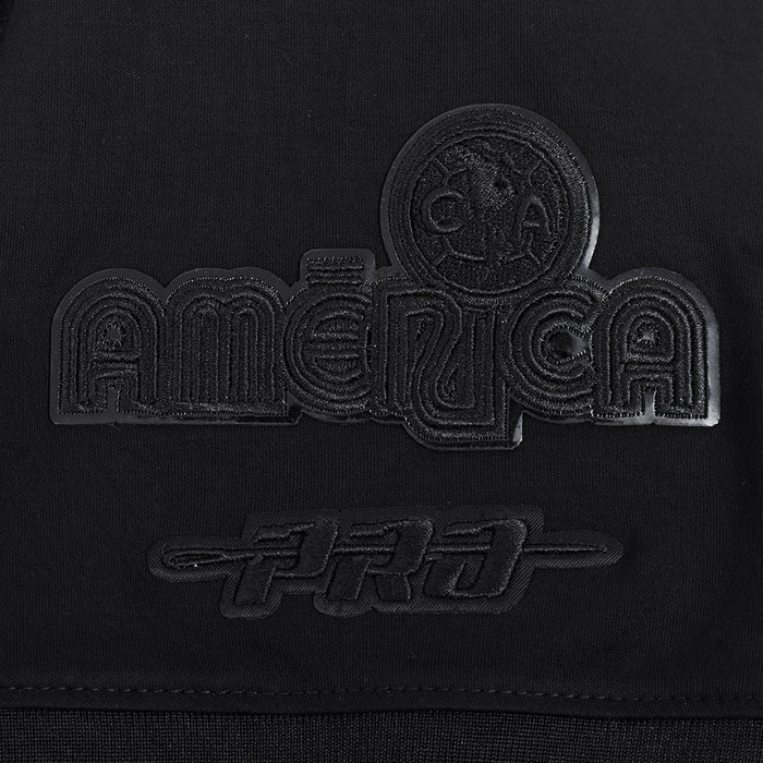 Triple black crew-neck T-shirt chest close-up of embossed crest and wordmark