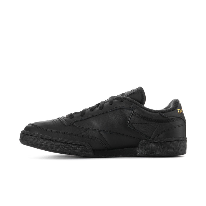 Black leather low-top sneaker with textured overlays and Reebok logo