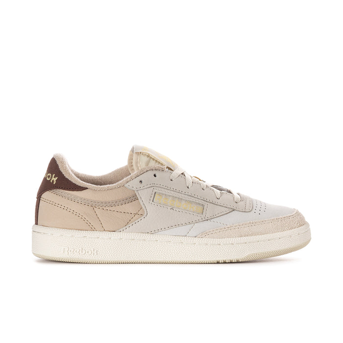 Beige low-top women's sneakers with brown side panel and lace-up closure