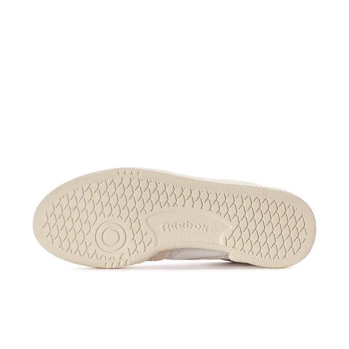 Beige rubber outsole with Reebok logo on low-top sneakers