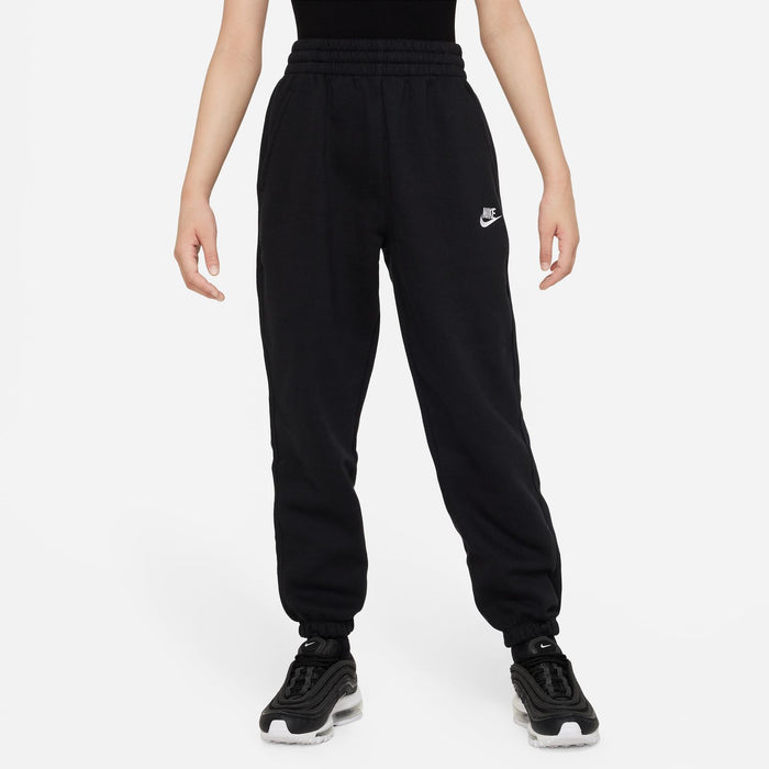 Youth black loose sweatpants with drawstring, tapered legs, and Nike logo on thigh
