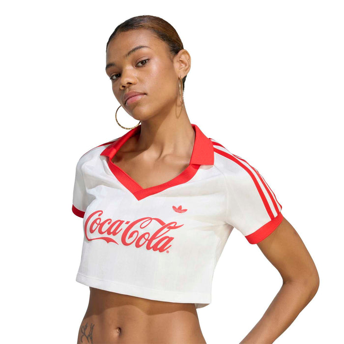 Womens graphic jersey on model, white with red trim and Coca Cola logo front
