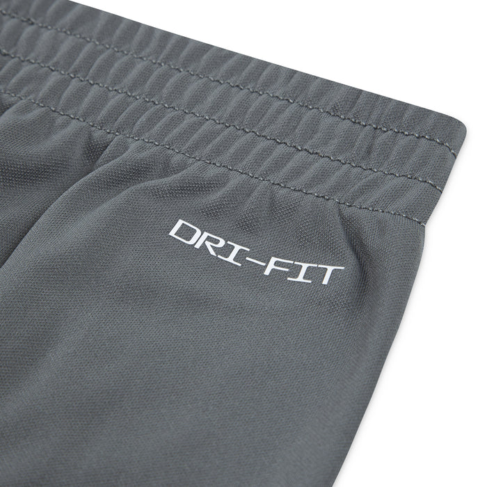 Dri-FIT logo on smoke grey elastic waistband of kids joggers.