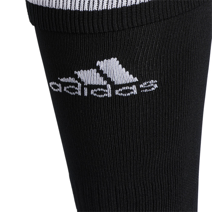 Crew sock shaft detail, black knit with white adidas logo and ribbed texture.