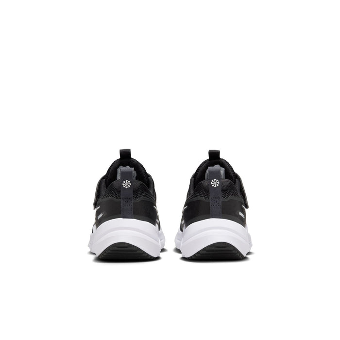 Kids black running shoes from heel view with white sole and loop pull tab