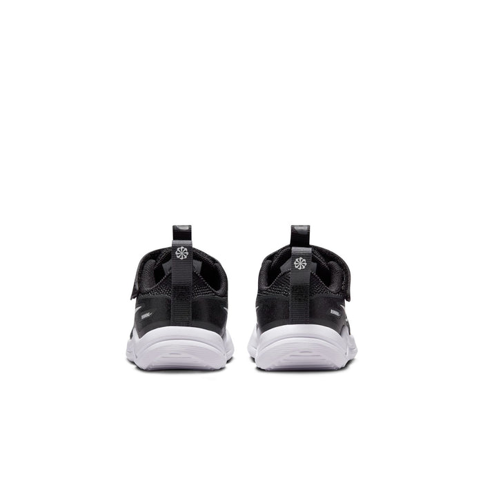 Toddler black sneakers with back pull tabs and white cushioned soles