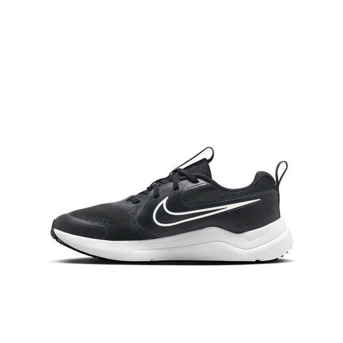 Youth black and white running shoe with streamlined swoosh and cushioned white sole