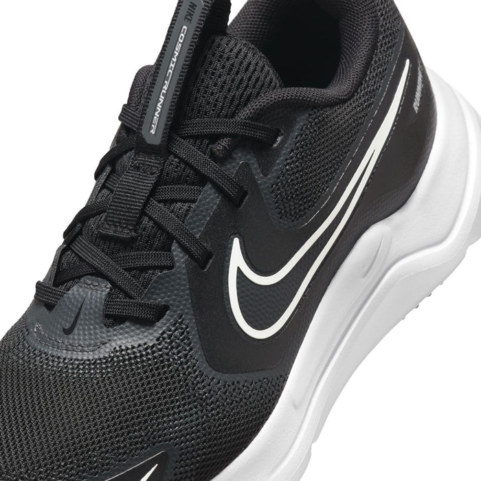 Youth black mesh running shoe close-up with swoosh logo and lace-up detail