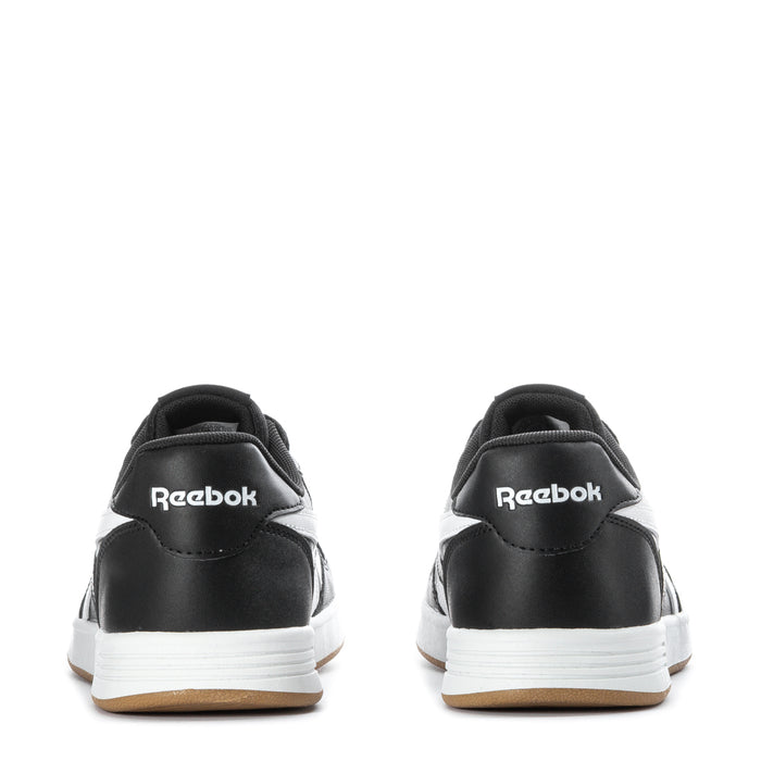 Black youth Reebok Court Advance sneakers with heel branding, white sidewall, gum outsole.
