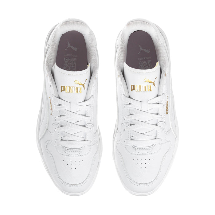 White Puma court sneakers, top view showing gold Puma logo on tongue