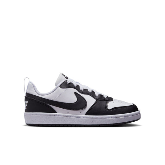 Youth low-top sneakers in white and black with swoosh logo and lace-up design