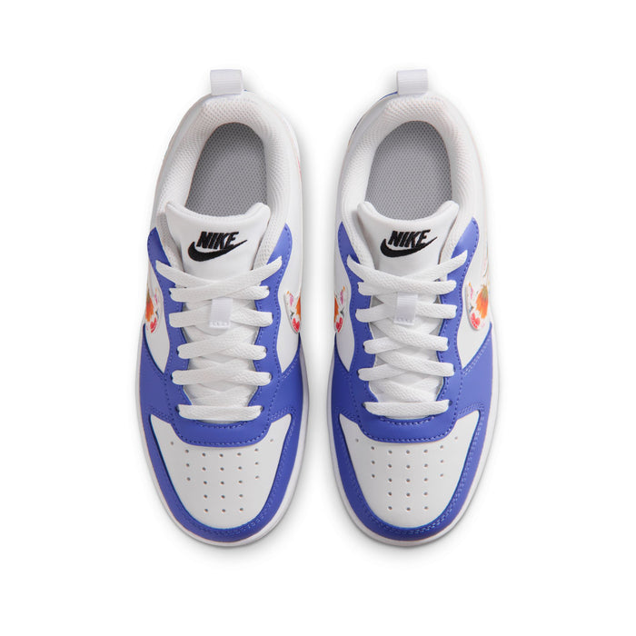 Youth sneakers front view: white toe box, blue sides, and white laces with logo