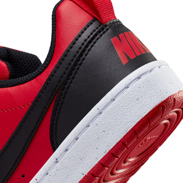 Close-up of youth red and black sneaker side with red logo detail and white midsole.