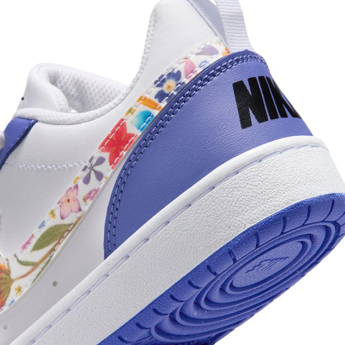 Close-up of youth sneaker side and heel: Nike logo on blue, textured outsole
