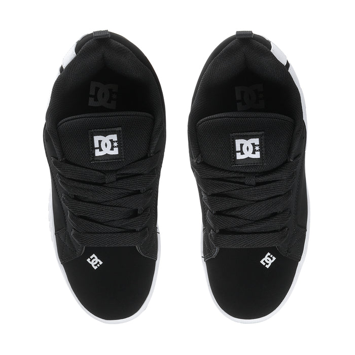 Black low-top sneakers with DC logo on heel tabs and black laces.