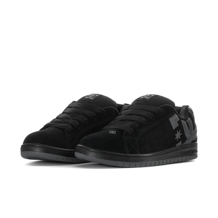 Youth black DC star skate shoes, low-top lace-up style with padded collar