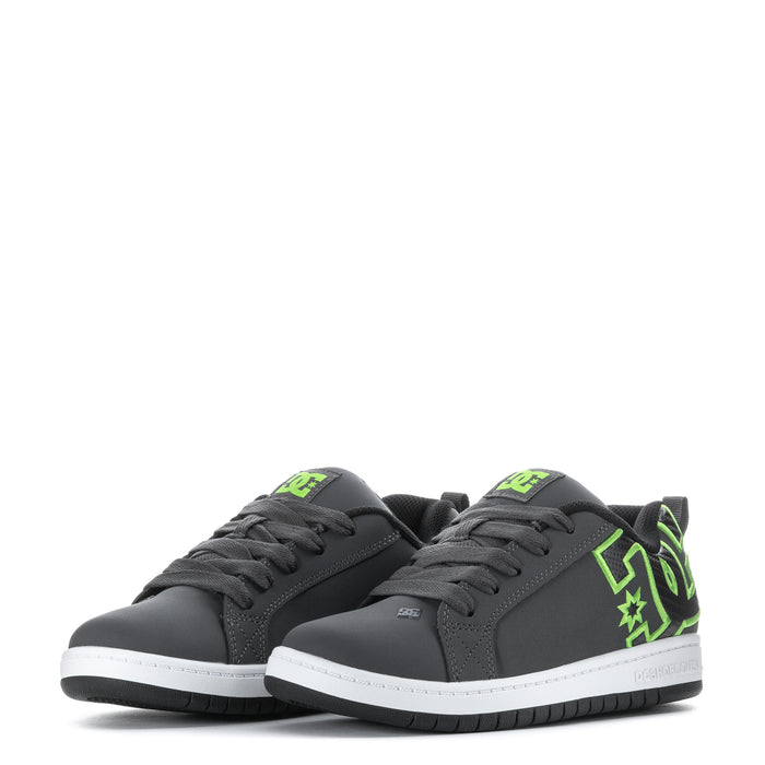 Pair of youth court sneakers with dark grey uppers, neon green side graphics, and laces