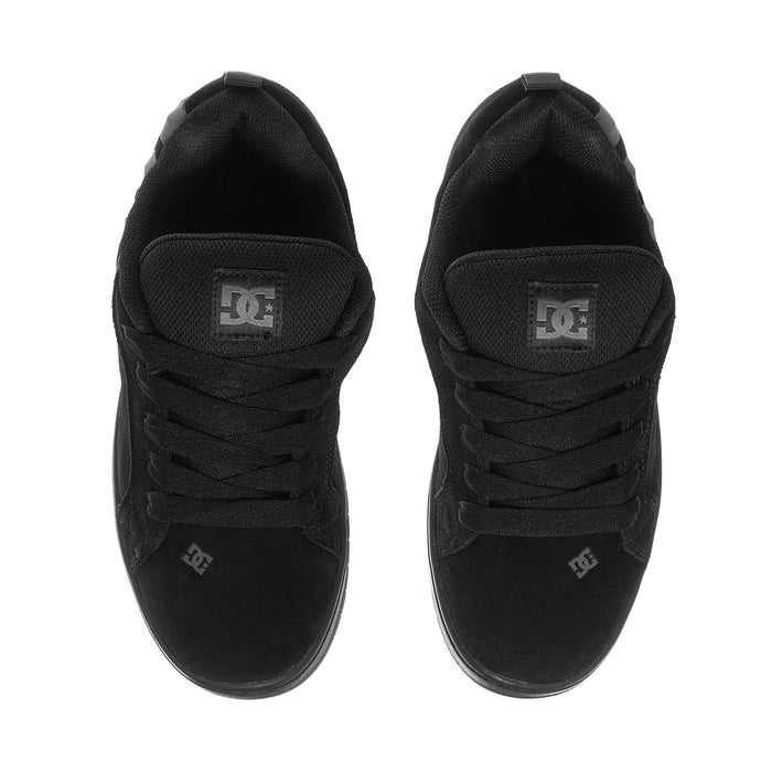 Youth black skate shoes, rear view with DC logo patch on the heel tab