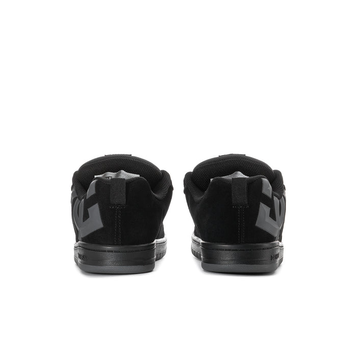 Youth black low-top skate shoes, back view with heel pull tab and branding