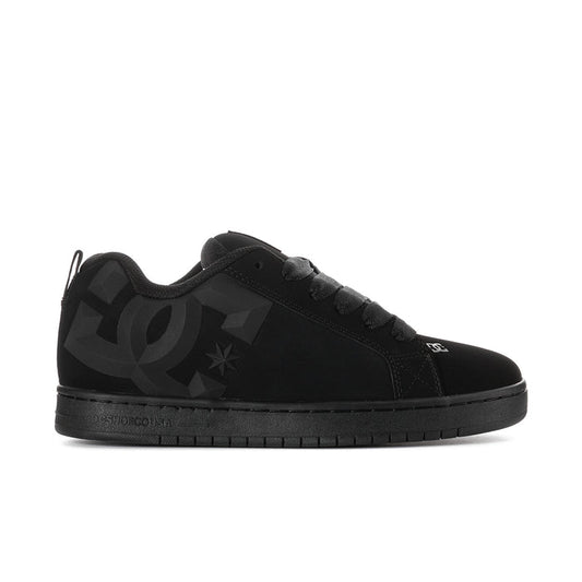 Black low-top skate sneakers with DC star logo and lace-up closure
